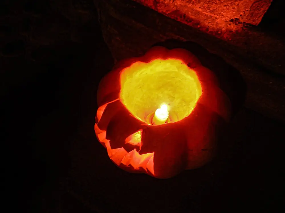A glowing carved jack-o'-lantern